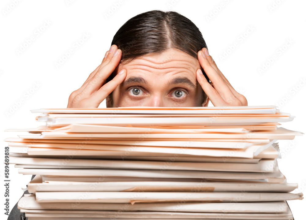 Closeup of a Worried Employee Behind Stack of Folders Closeup of a Worried Employee Behind Stack of Folders