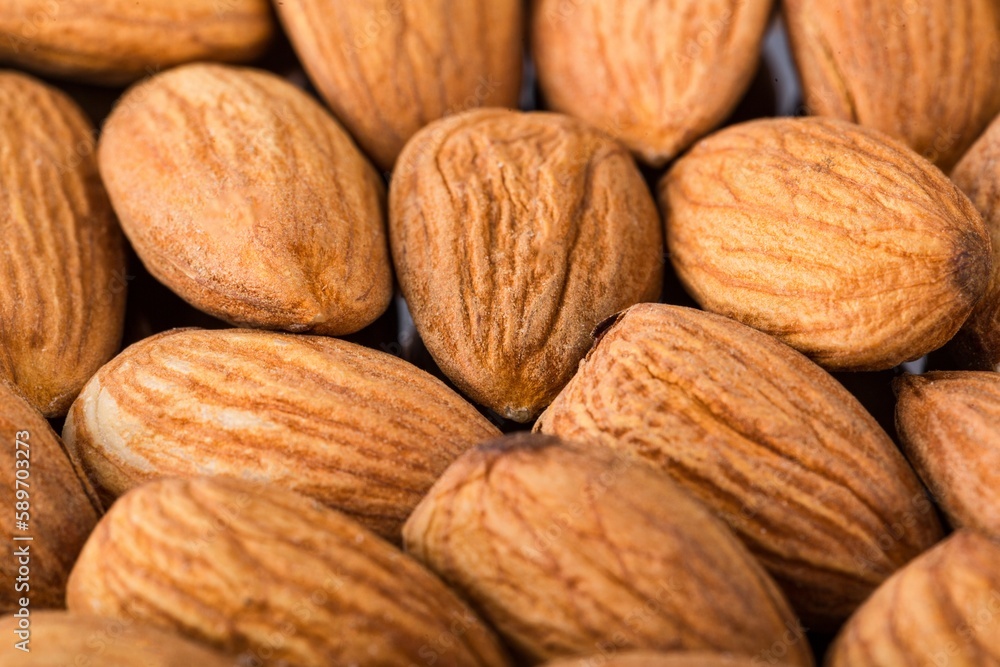 The delicious fresh almond nut on deck The delicious fresh almond nut on deck