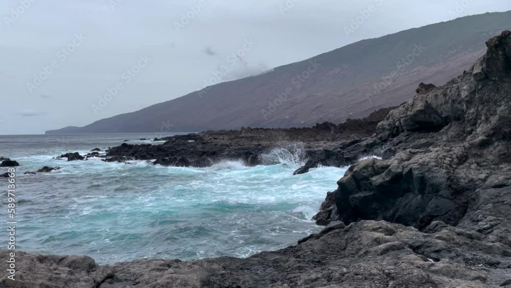 waves crashing on cloudy day at Tacoron beach in El Hierro, Canary Islands waves crashing on cloudy day at Tacoron beach in El Hierro, Canary Islands