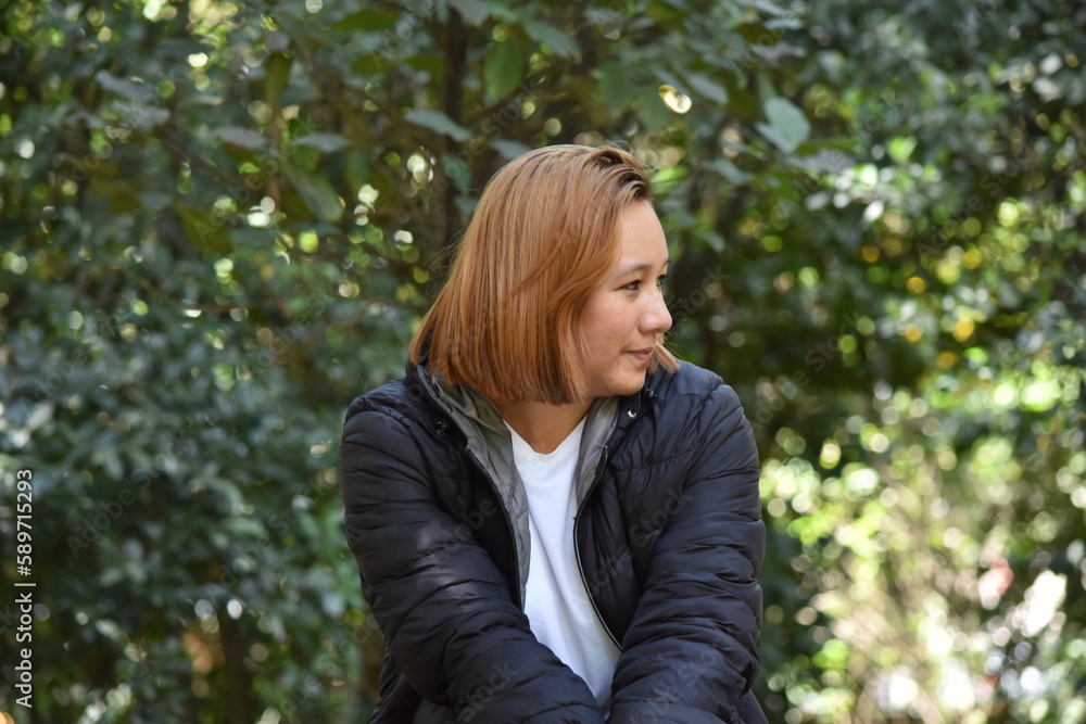 Woman Model sitting in the Botanical Garden of Bogota Colombia Woman Model sitting in the Botanical Garden of Bogota Colombia
