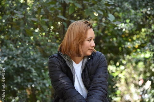 Woman Model sitting in the Botanical Garden of Bogota Colombia