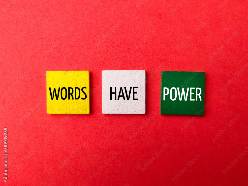 Colored wooden cube with the word WORDS HAVE POWER