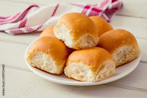 Soft bread rolls on white plate