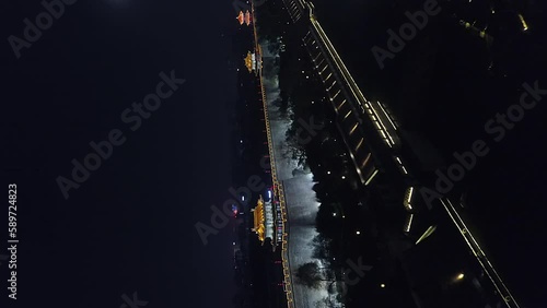 Vertical format night aerial to illuminated crenels on Xi'an city wall