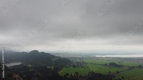 Aerial reveal view of Lake Lucerne and GermanCastle and the Swiss Alps