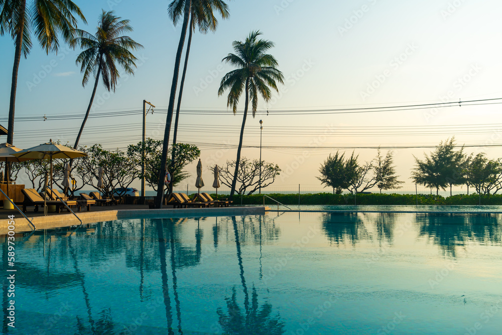 umbrella with bed pool around swimming pool with ocean sea background umbrella with bed pool around swimming pool with ocean sea background