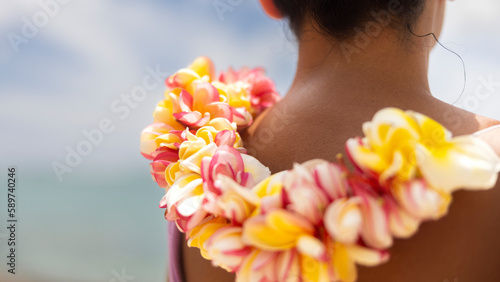Woman making Hawaiian Lei and Hahu. Process of Handmade flower crown made from Hawaii flower Plumeria. photo