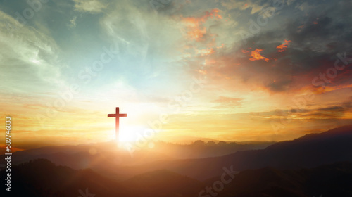 Leinwand Poster The crucifix symbol of Jesus on the mountain sunset sky background