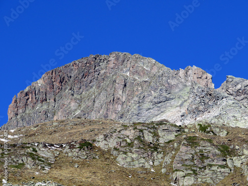 Rocky mountain peak Piz Radönt or Piz Radoent (3064 m) in the Albula Alps and above the alpine valley Val Grialetsch, Zernez - Canton of Grisons, Switzerland (Kanton Graubünden, Schweiz)