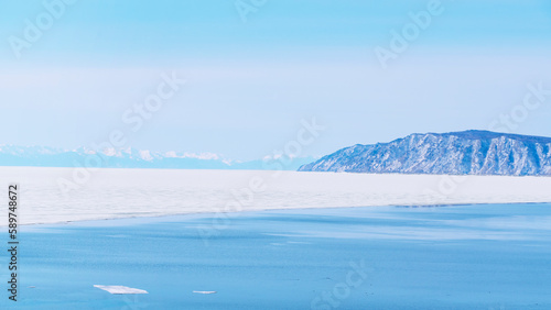 source of the Angara River in the village of Listvyanka. Lake Baikal spring, the time of melting ice.