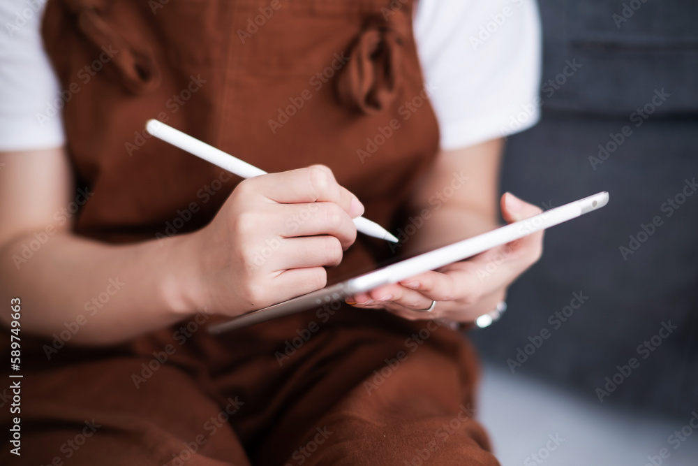 Hands of people using tablet and electronic pen Hands of people using tablet and electronic pen
