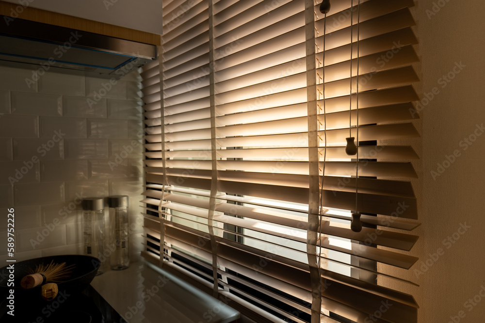 blinds background blinds with sunlight background, defocus on the blinds on the window, blinds in window kitchen background. blinds background blinds with sunlight background, defocus on the blinds on the window, blinds in window kitchen background.