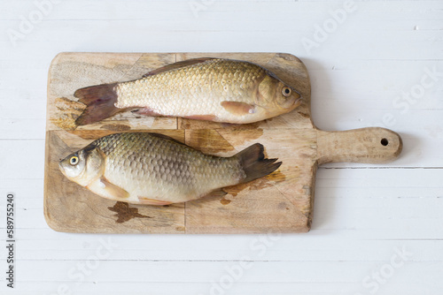 river raw fish on wooden table