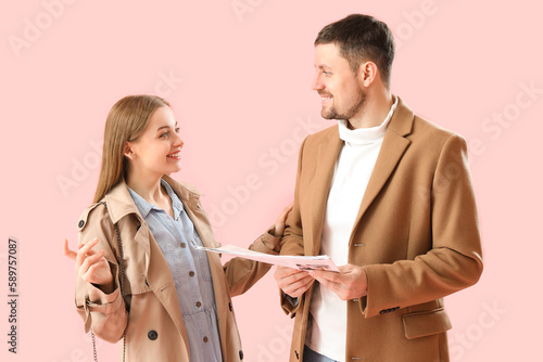 Young couple with newspaper...