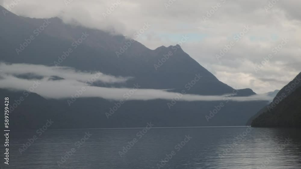 stunning vista mist-covered mountain with clouds hovering in front, dramatic panoramic view of majestic landscape, New Zealand's South Island stunning vista mist-covered mountain with clouds hovering in front, dramatic panoramic view of majestic landscape, New Zealand's South Island
