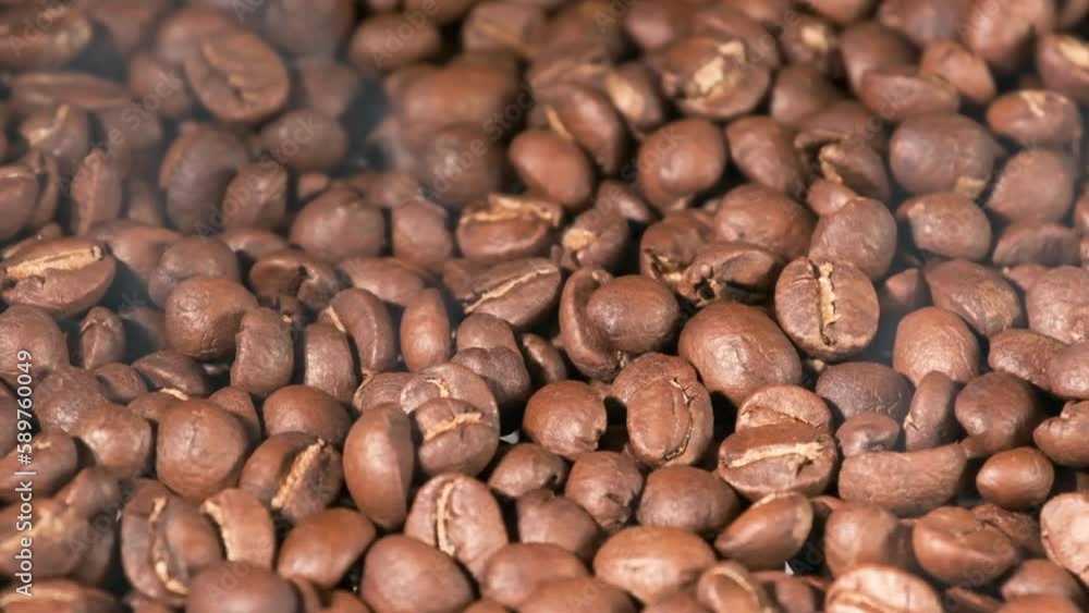 Slow motion of roasted coffee beans falling. Organic coffee seeds. Slow motion of roasted coffee beans falling. Organic coffee seeds.
