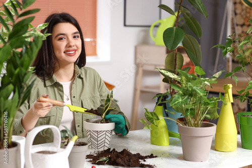 Young woman transplanting g...