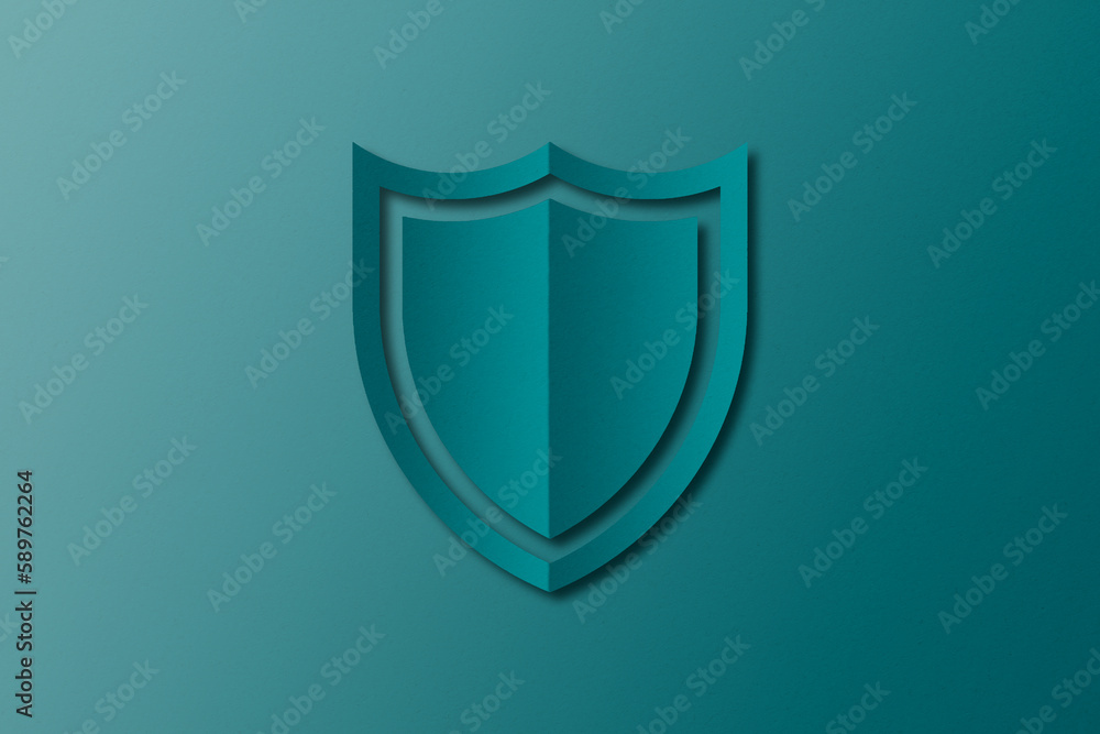 green paper shield Paper cut out punched into shield shape set on green paper background. green paper shield Paper cut out punched into shield shape set on green paper background.
