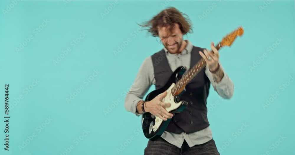 Punk, music and guitar with man in studio for performance, crazy and concert. Metal, creative and entertainment with male and instrument isolated on blue background for dance, vintage and musician Punk, music and guitar with man in studio for performance, crazy and concert. Metal, creative and entertainment with male and instrument isolated on blue background for dance, vintage and musician