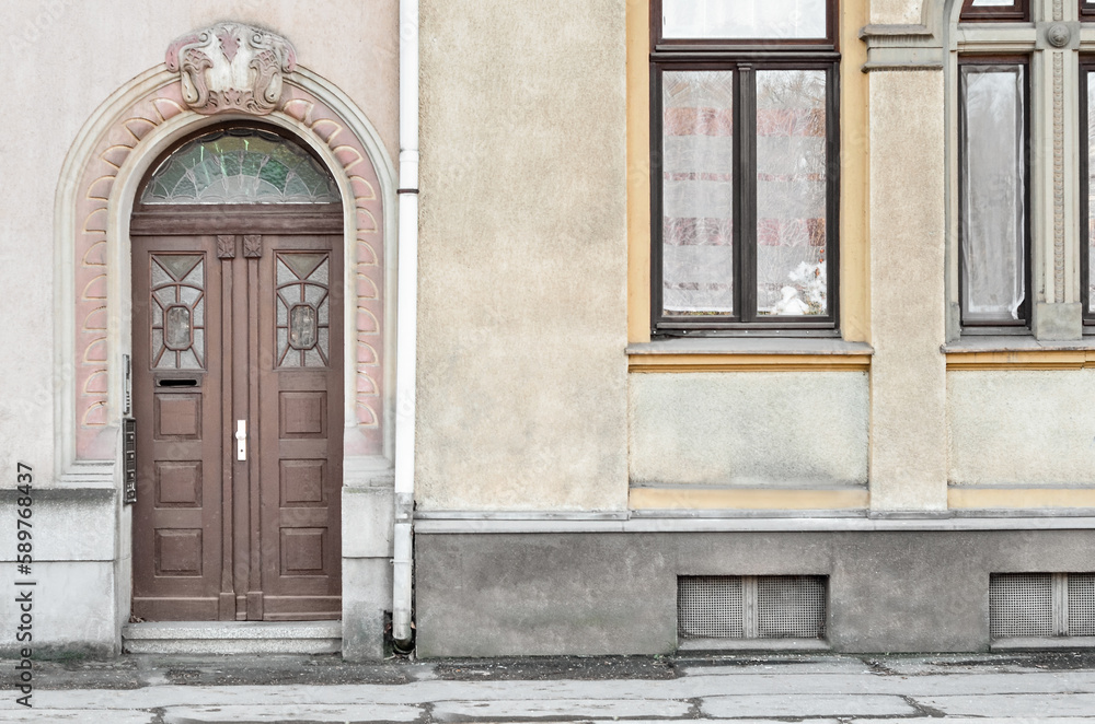 Fototapeta premium View of old building with wooden door and windows