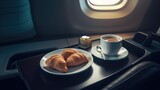 Breakfast on a plane with cup of coffee and fresh croissant. Generative AI