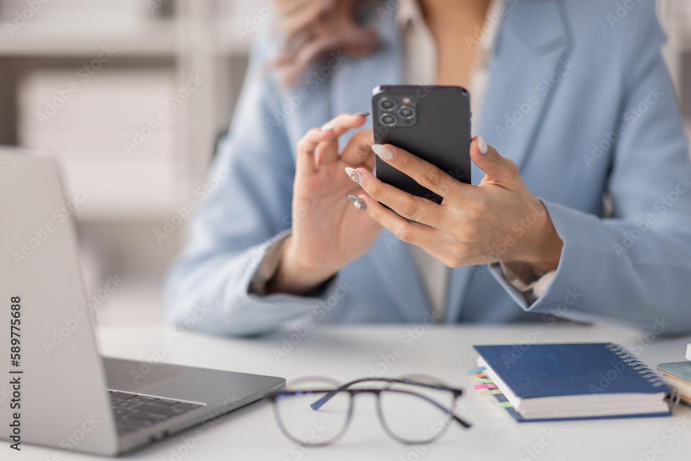 Asian women hold smartphone and use pc at the workplace. Project stats financial data sales charts on laptop and cellphone
Asian women hold smartphone and use pc at the workplace. Project stats financial data sales charts on laptop and cellphone