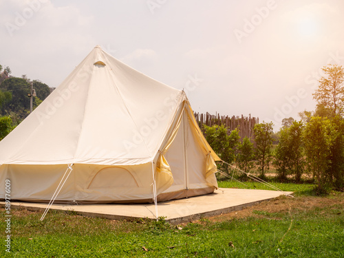 Camping picnic tent campground in outdoor hiking forest. Camper while campsite in nature background at summer trip camp. Adventure Travel Vacation concept