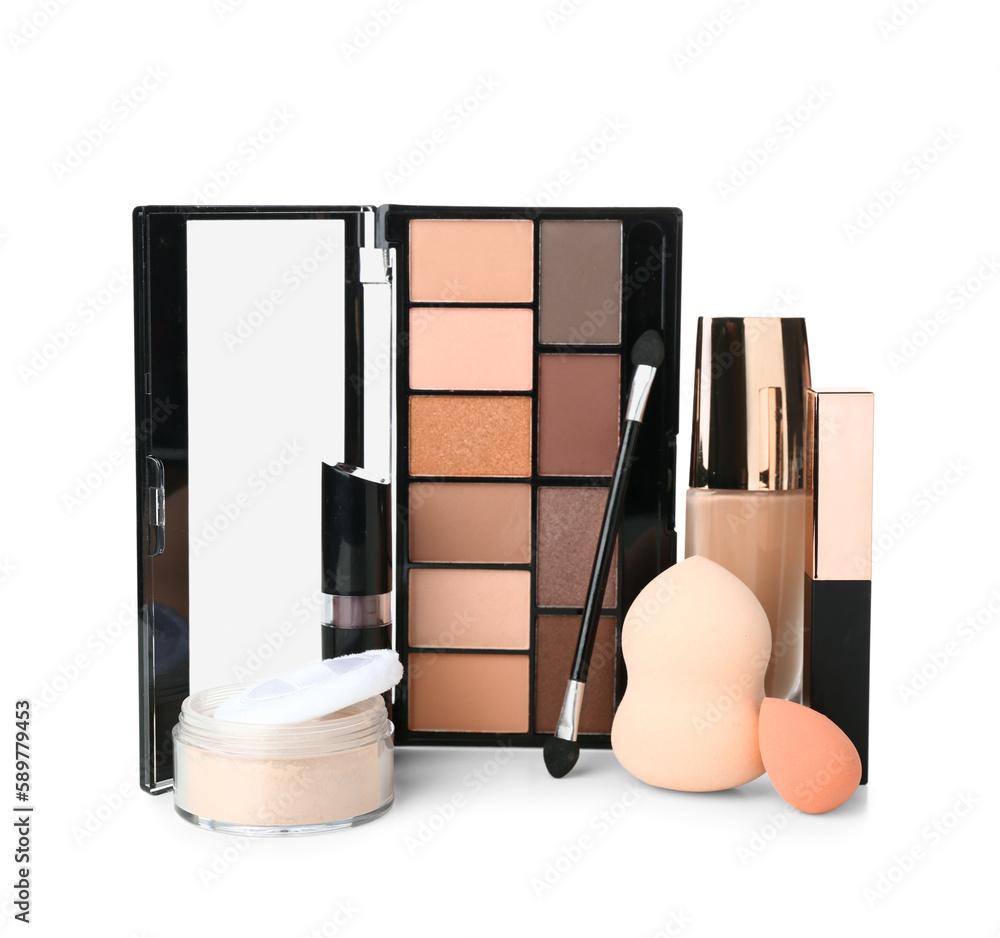 Fototapeta Decorative cosmetics with brush and sponges on white background