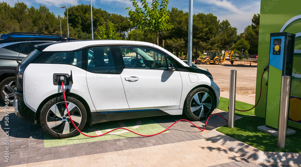 Charging an electric car on parking in a shopping mall.