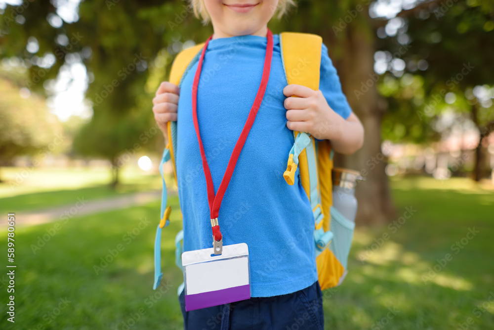 Child with name badge on neck goes to school. Icon has white blank card for copy of text. This is student identification label with an empty ID card layout. Child with name badge on neck goes to school. Icon has white blank card for copy of text. This is student identification label with an empty ID card layout.