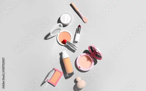Obraz Decorative cosmetics with makeup brush and sponges on grey background
