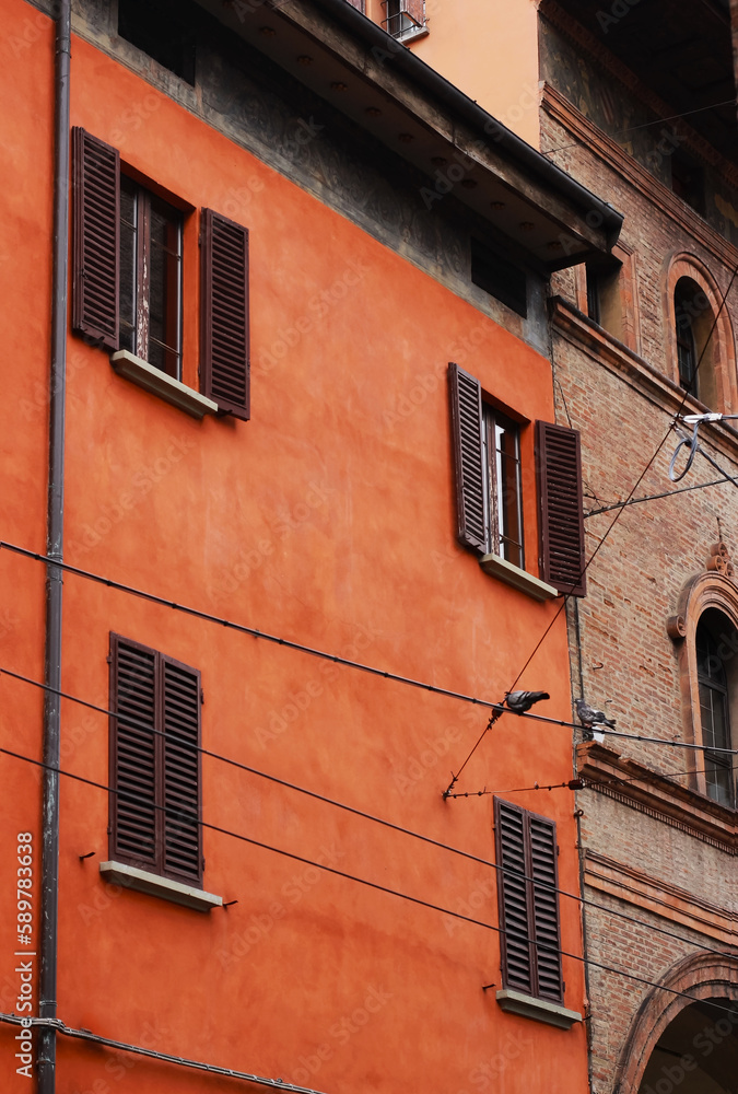 Classic italian mediterranean orange house front in Bologna, Italy.