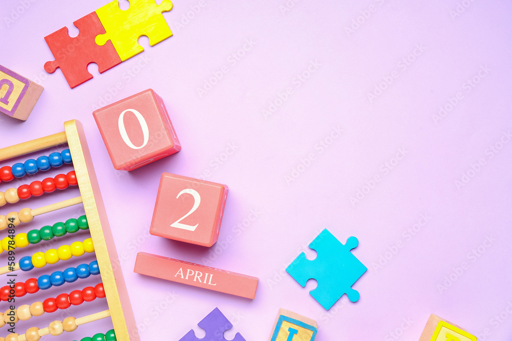 Date of World Autism Awareness Day with baby toys on lilac background Date of World Autism Awareness Day with baby toys on lilac background