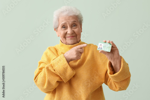 Senior woman pointing at dr...