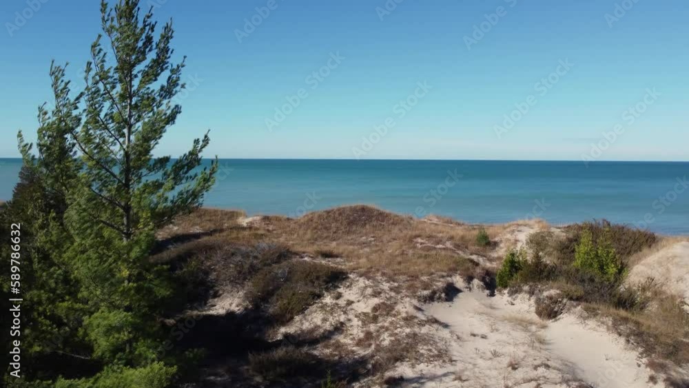 Aerial view flying around Pinery provincial park Ontario, Canada coastal sandy woodland shoreline looking across lake Huron Aerial view flying around Pinery provincial park Ontario, Canada coastal sandy woodland shoreline looking across lake Huron