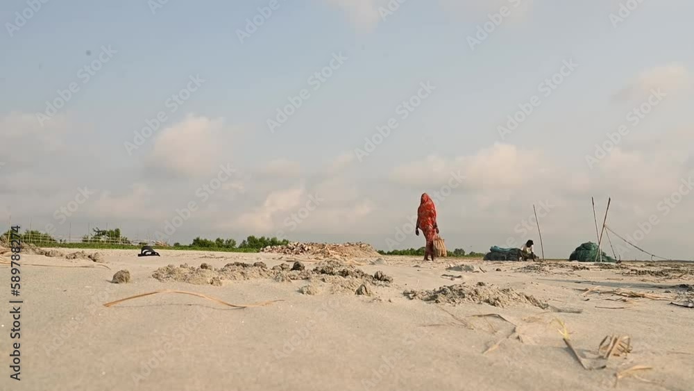 People are getting ready at morning to stat their daily work. They are fisher man and making temporary shelter where they can get some shadow at resting time. People are getting ready at morning to stat their daily work. They are fisher man and making temporary shelter where they can get some shadow at resting time.