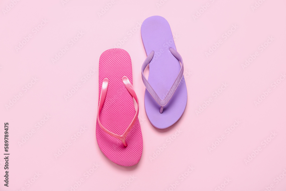 Different flip-flops on pink background