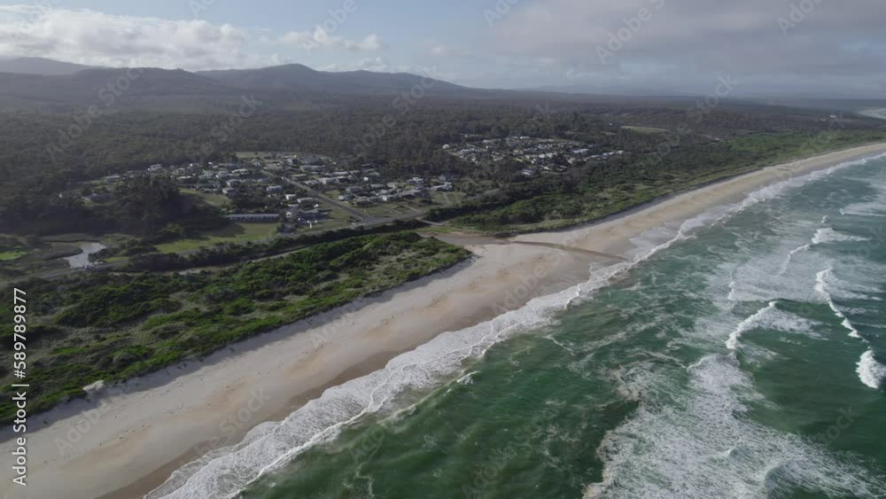 Idyllic Seascape At Beaumaris Beach In North East Region Of Tasmania, Australia - aerial drone shot Idyllic Seascape At Beaumaris Beach In North East Region Of Tasmania, Australia - aerial drone shot