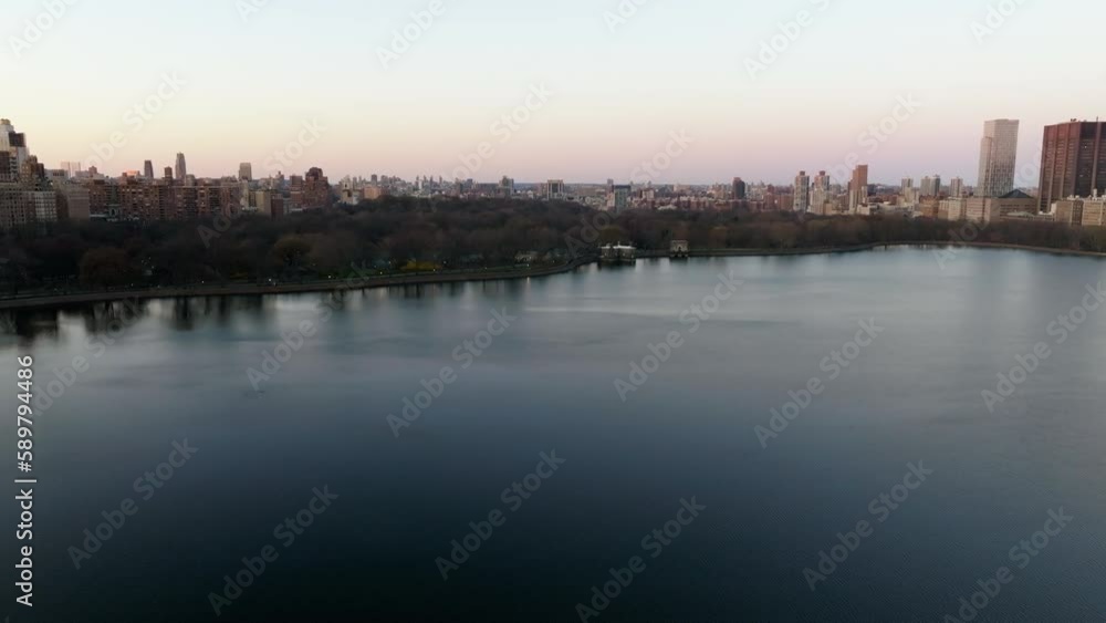 Aerial view over the reservoir, toward the north coast of Central park, sunset in New York, USA Aerial view over the reservoir, toward the north coast of Central park, sunset in New York, USA