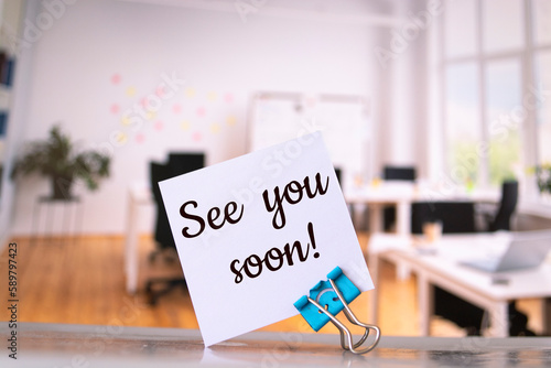 Bild auf Leinwand See You Soon with a smile written on a memo at the office