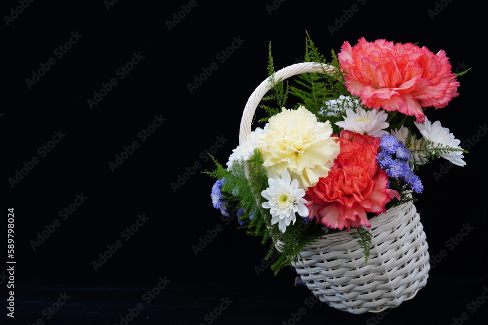 Multi-colored flowers in white pots