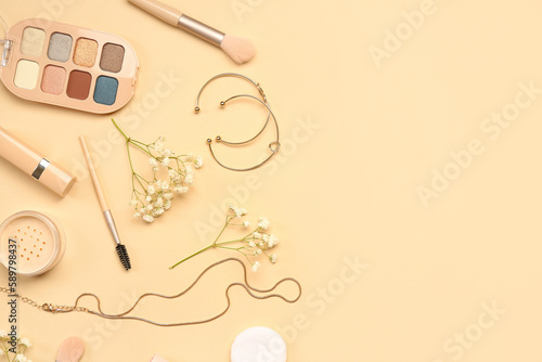 Female accessories with flowers on beige background