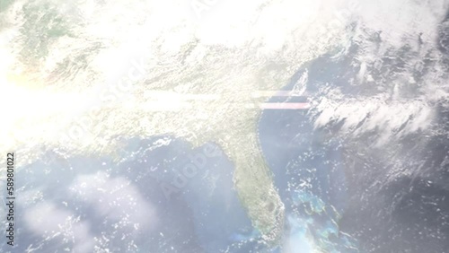Earth zoom in from outer space to city. Zooming on Valdosta, Georgia, USA. The animation continues by zoom out through clouds and atmosphere into space. Images from NASA