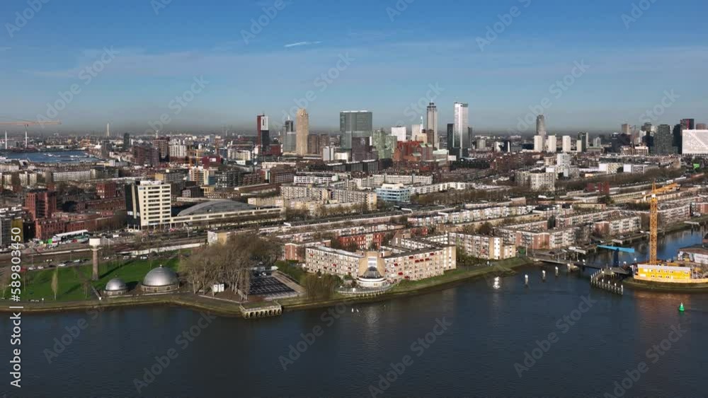 Aerial over New Meuse river with panoramic cityscape view of Rotterdam Aerial over New Meuse river with panoramic cityscape view of Rotterdam