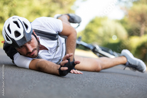 man cyclist fell off road bike while cycling