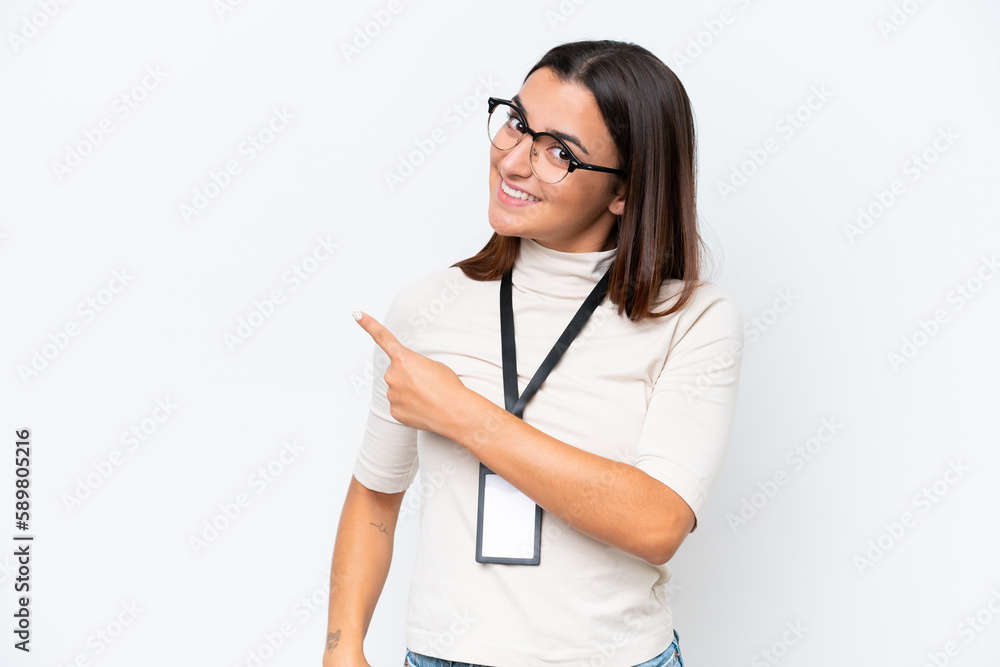 Young caucasian woman with ID card isolated on white background pointing back Young caucasian woman with ID card isolated on white background pointing back