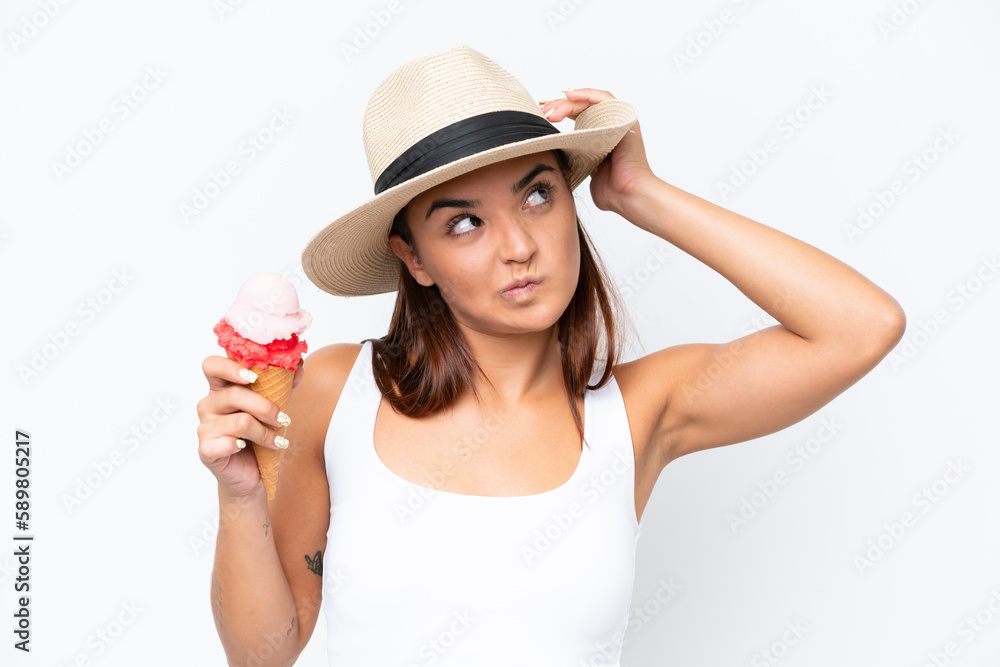 Young caucasian woman with a cornet ice cream isolated on white background having doubts and with confuse face expression Young caucasian woman with a cornet ice cream isolated on white background having doubts and with confuse face expression
