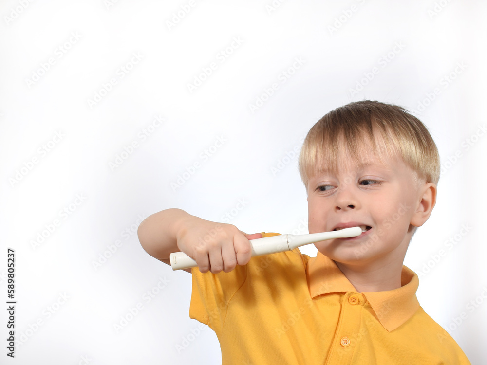 a boy child brushes his teeth a boy child brushes his teeth
