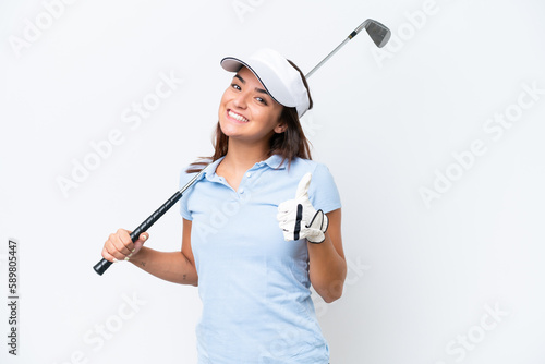 Young caucasian woman playing golf isolated on white background giving a thumbs up gesture