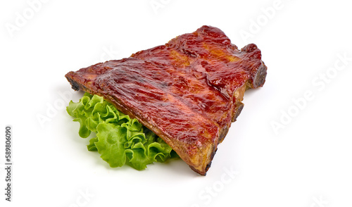 Delicious spicy marinated ribs in a bbq or tomato sauce with herbs, isolated on a white background.